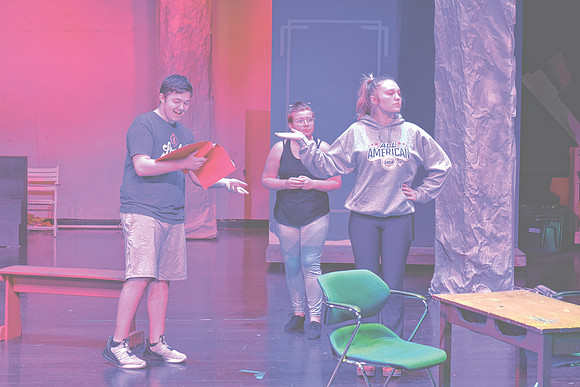 Eva Dean, one of the two students portraying The Queen of Hearts in "Alice in Wonderland," at right, rehearses a scene with fellow cast members, Wednesday, Oct. 23, 2024, at Greenwood Community High S