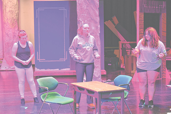 Eva Dean, one of the two students portraying The Queen of Hearts in "Alice in Wonderland," center, rehearses a scene with fellow cast members, Wednesday, Oct. 23, 2024, at Greenwood Community High Sch