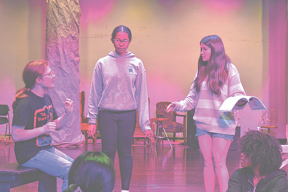 Nicky Sergi, who is portraying Alice in Greenwood's production of "Alice in Wonderland," at center, rehearses with other cast members, Wednesday, Oct. 23, 2024, at Greenwood Community High School in G