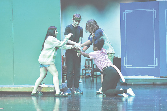 Nicky Sergi as "Alice," Adam Soboleski as "The March Hare," Jonathan Chelf as "The Mad Hatter," and Ruby Martin as "The Dormouse," pictured clockwise from left, rehearse a scene from "Alice in Wonderl