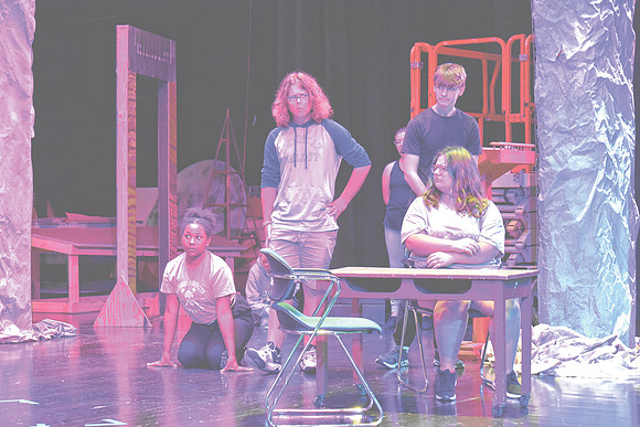 From left, Ruby Martin as "The Dormouse," Jonathan Chelf as " The Mad Hatter" and Adam Soboleski as "The March Hare" rehearse a scene from "Alice in Wonderland" with other students, Wednesday, Oct. 23